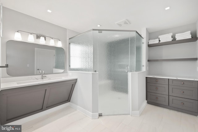 bathroom with vanity and an enclosed shower