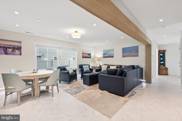 living room featuring beam ceiling