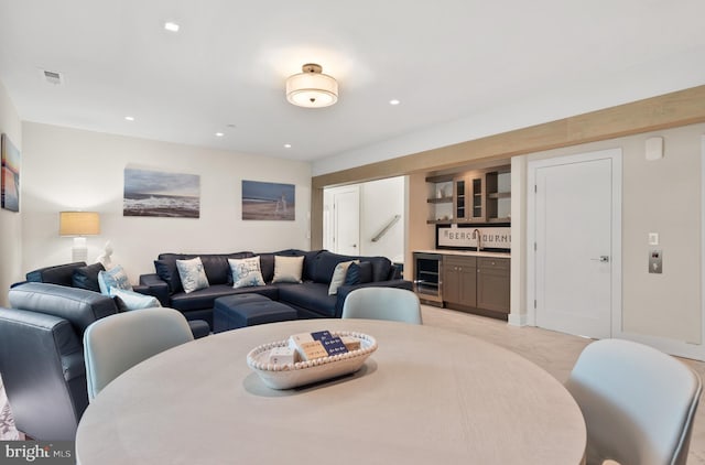 dining space with sink and beverage cooler