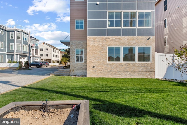 view of property exterior featuring a lawn