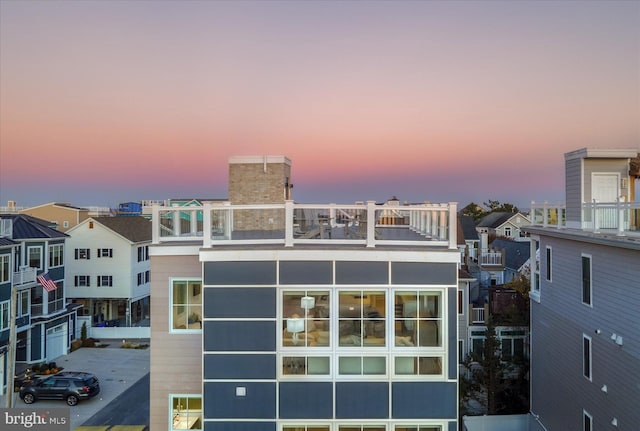 view of back house at dusk