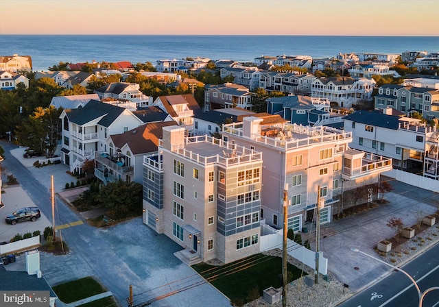 aerial view at dusk with a water view