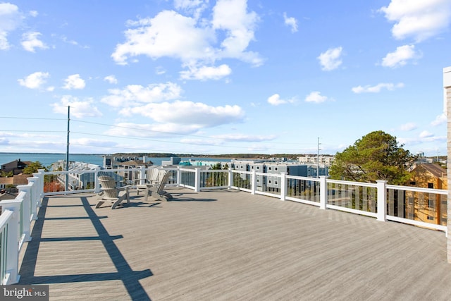 wooden deck with a water view