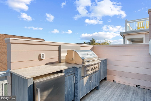 view of patio / terrace featuring an outdoor kitchen and grilling area