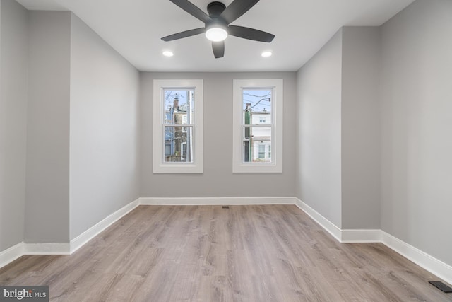 unfurnished room with light hardwood / wood-style flooring and ceiling fan