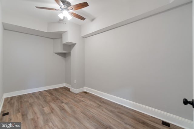 interior space featuring light wood-type flooring and ceiling fan