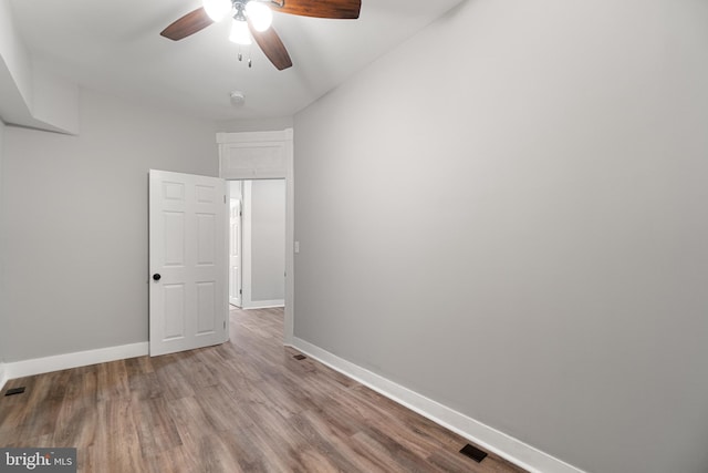 spare room with light hardwood / wood-style flooring and ceiling fan