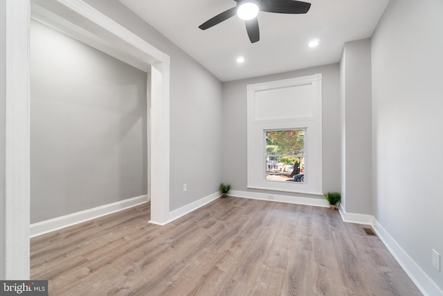 spare room with ceiling fan and light hardwood / wood-style floors