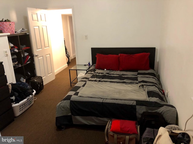 bedroom with dark carpet