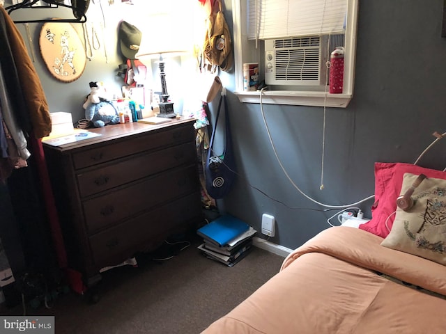 bedroom with cooling unit and carpet floors