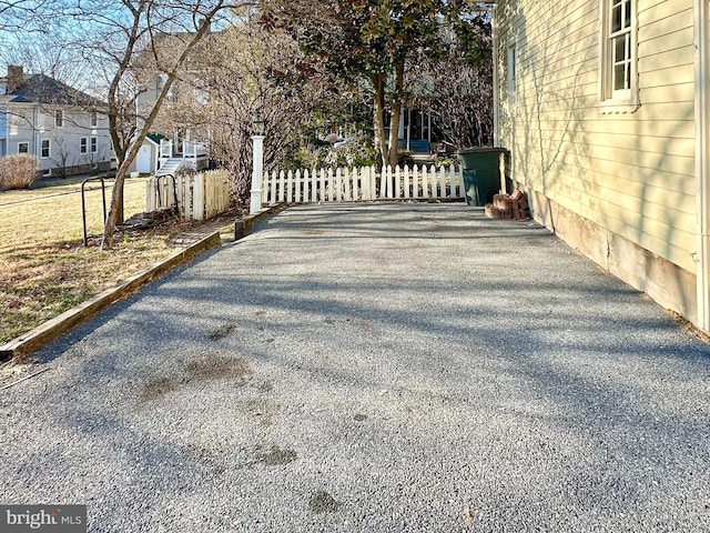 view of gate with fence