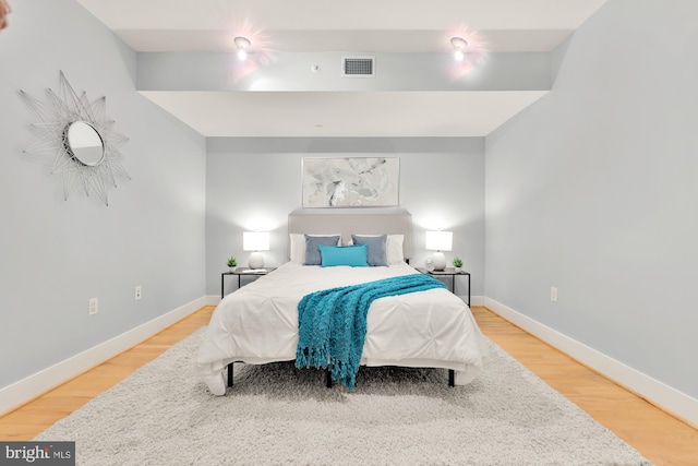 bedroom featuring hardwood / wood-style flooring