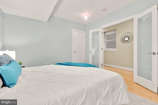 bedroom with hardwood / wood-style floors