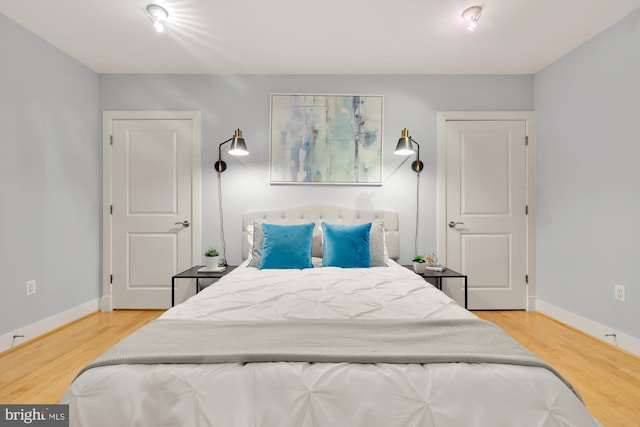 bedroom featuring hardwood / wood-style floors