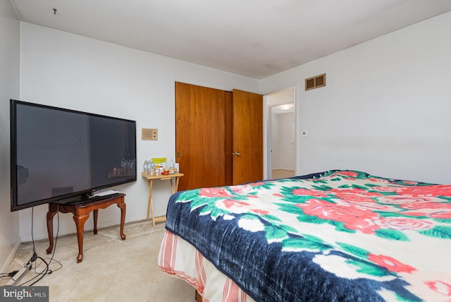 bedroom featuring light colored carpet