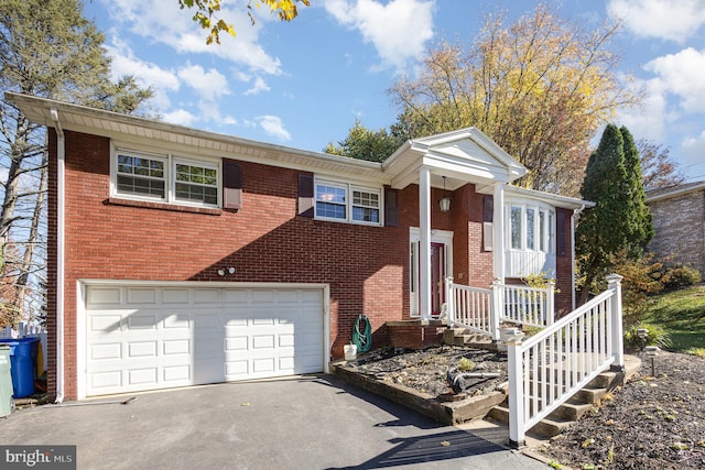 raised ranch featuring a garage