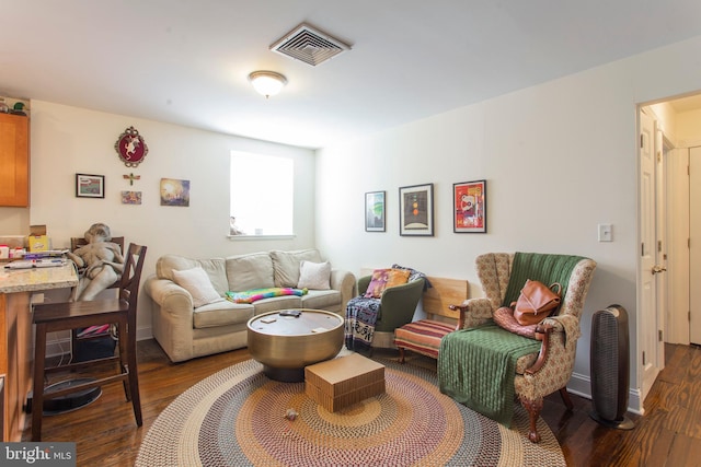 living room with dark hardwood / wood-style flooring