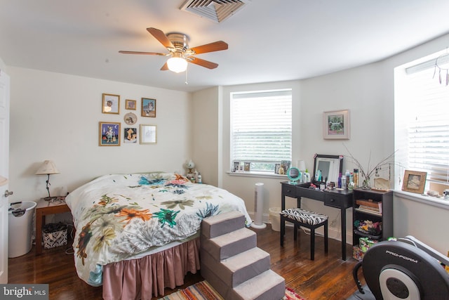 bedroom featuring ceiling fan and dark hardwood / wood-style flooring