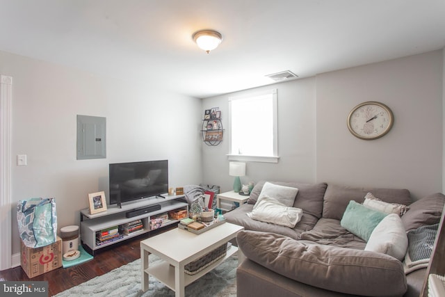 living room featuring electric panel and dark wood-type flooring