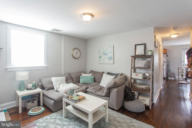 living room with dark hardwood / wood-style floors