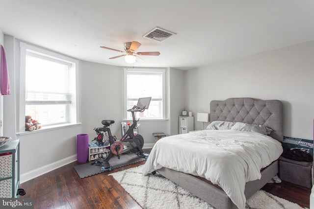 bedroom featuring ceiling fan and dark hardwood / wood-style flooring