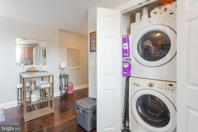 laundry room featuring dark hardwood / wood-style flooring and stacked washer and dryer