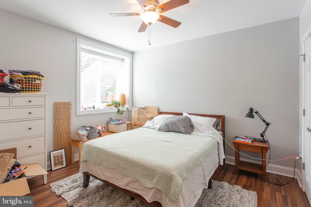 bedroom featuring ceiling fan and dark wood-type flooring