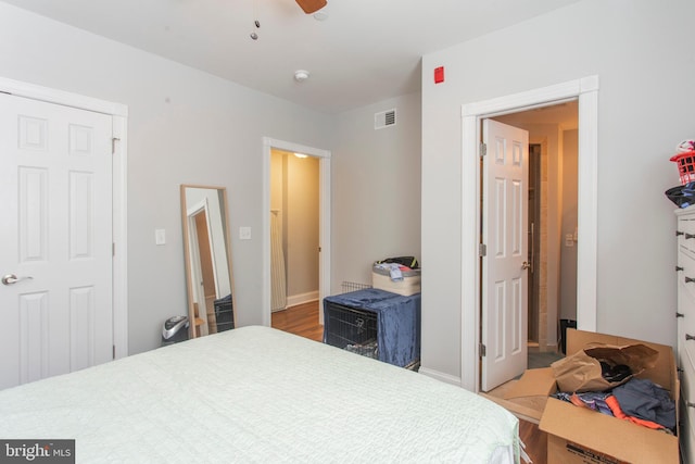 bedroom featuring light wood-type flooring and ceiling fan