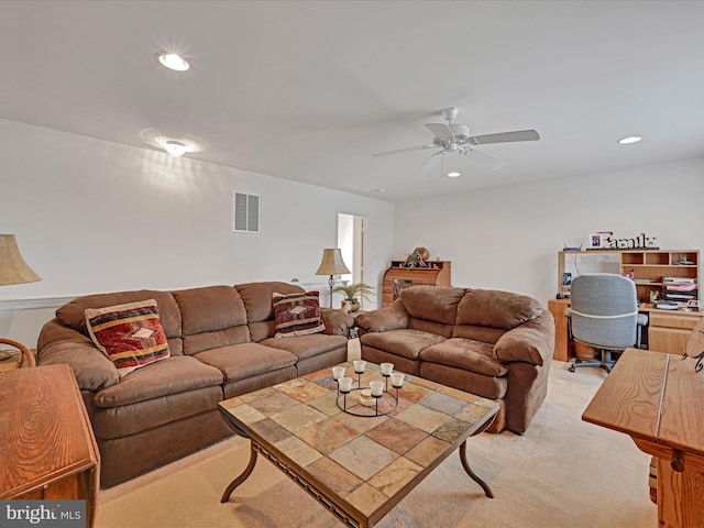 living room with light colored carpet and ceiling fan