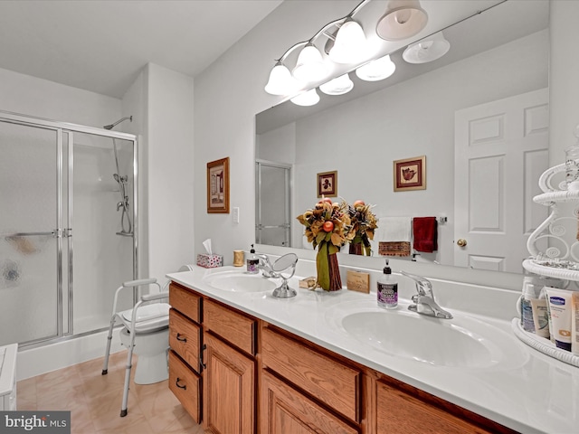 bathroom featuring walk in shower, vanity, toilet, and tile patterned floors