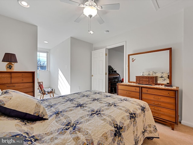 bedroom with light carpet and ceiling fan