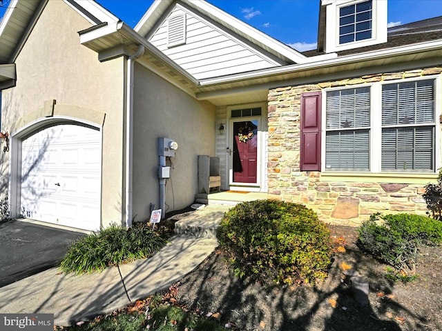 property entrance with a garage