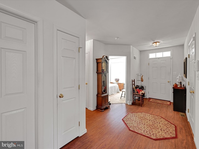 entryway with hardwood / wood-style flooring