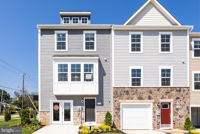 townhome / multi-family property featuring a garage