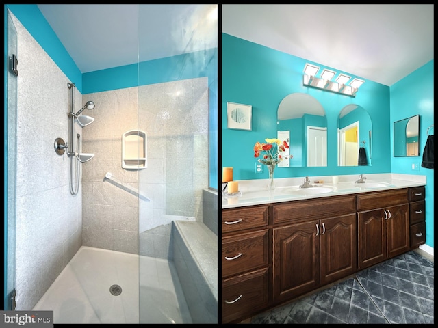 bathroom featuring a tile shower, vanity, and tile patterned floors