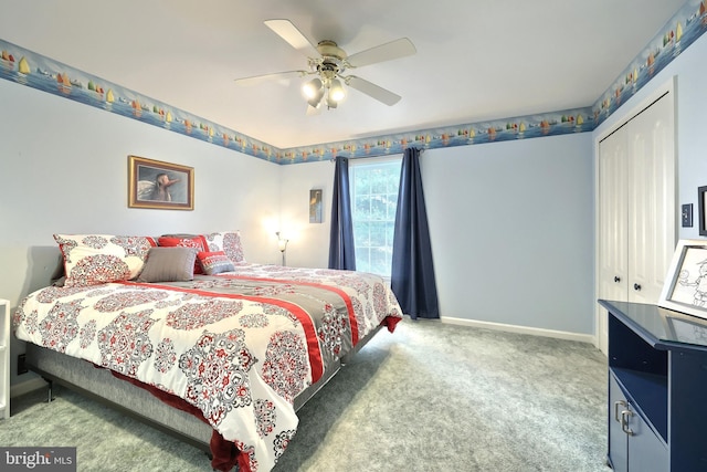 carpeted bedroom featuring ceiling fan and a closet