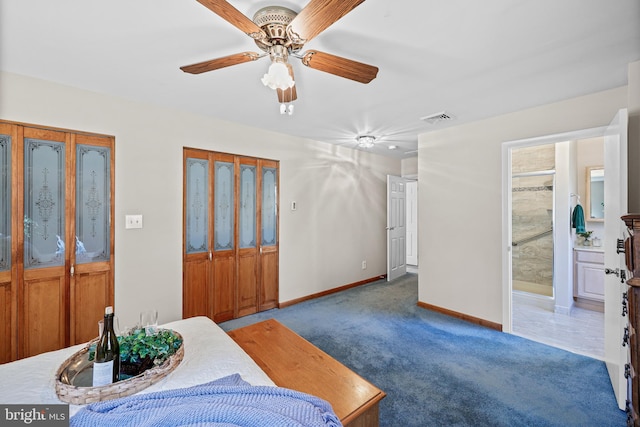 foyer featuring ceiling fan and dark carpet