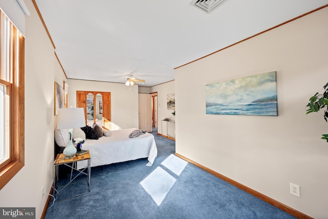 bedroom with ceiling fan and dark carpet