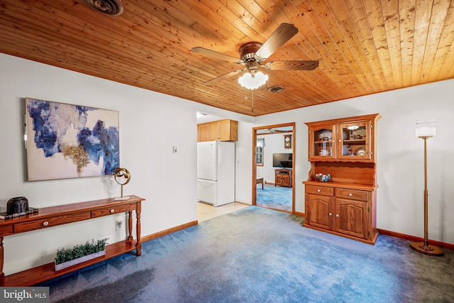 living room with ceiling fan, wooden ceiling, and light colored carpet