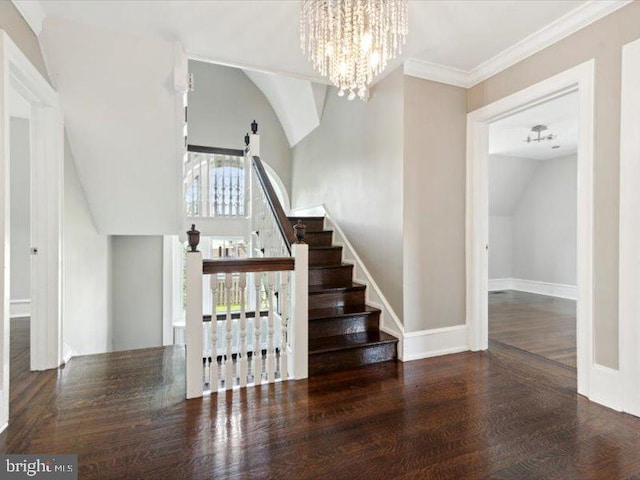 staircase featuring crown molding, a chandelier, and hardwood / wood-style flooring