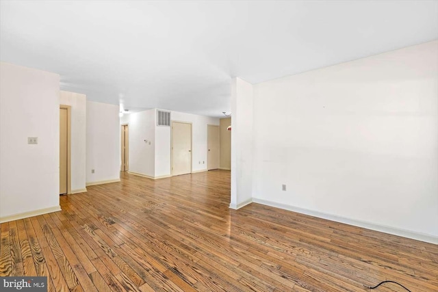 spare room featuring hardwood / wood-style flooring