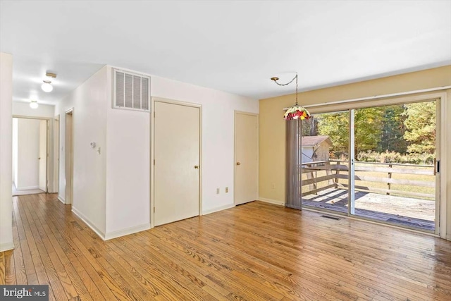 unfurnished room featuring light hardwood / wood-style flooring