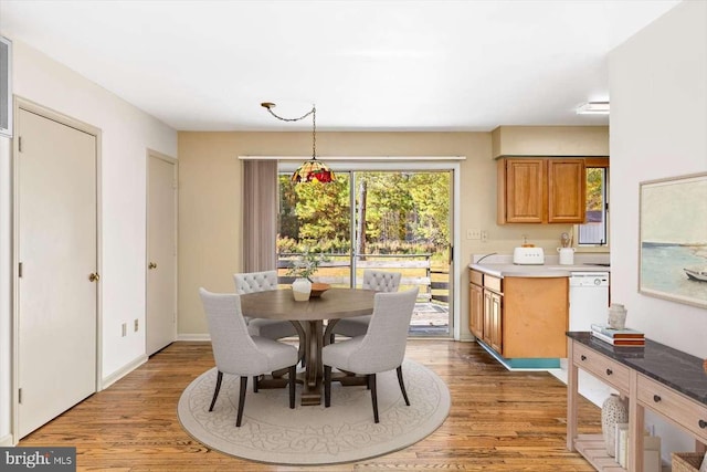 dining area with dark hardwood / wood-style floors