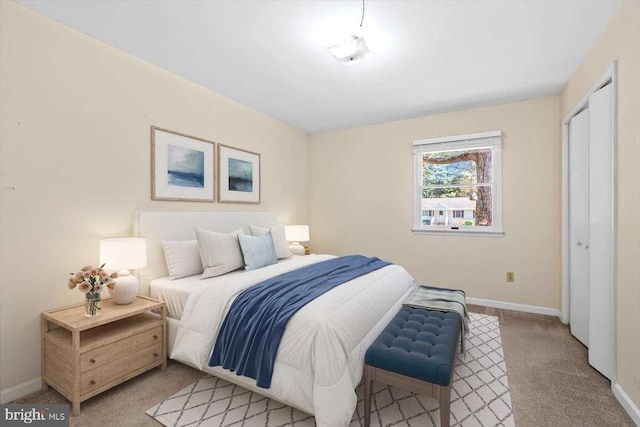 carpeted bedroom with a closet