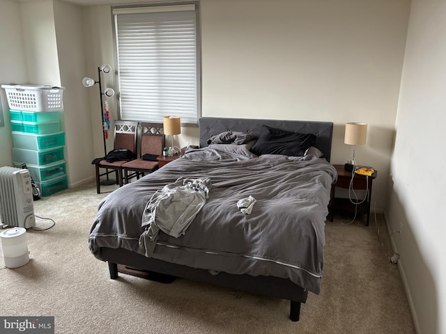 carpeted bedroom with baseboards