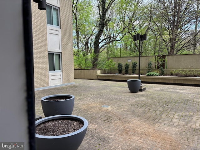 view of patio / terrace featuring fence