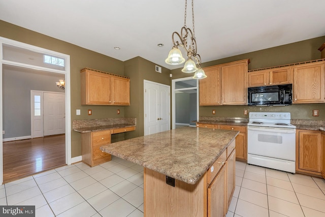 kitchen featuring light tile patterned flooring, an inviting chandelier, hanging light fixtures, a center island, and electric range