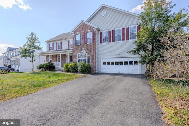 view of front of house featuring a garage and a front yard