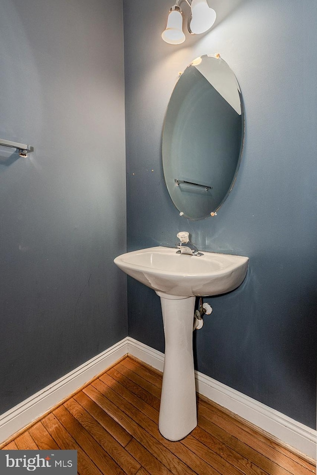 bathroom with hardwood / wood-style flooring