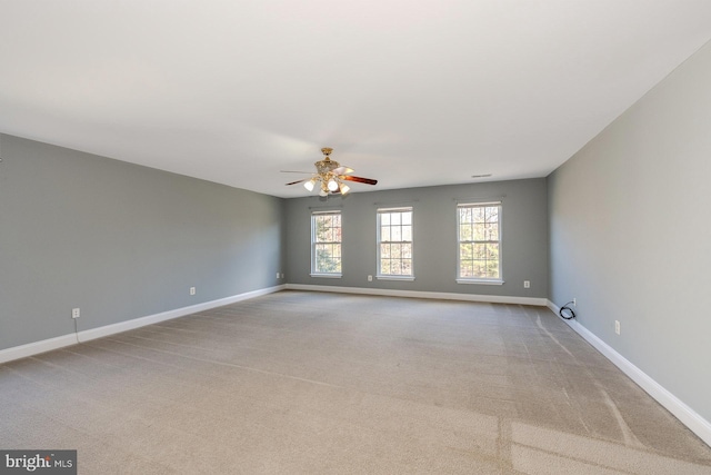 carpeted empty room with ceiling fan